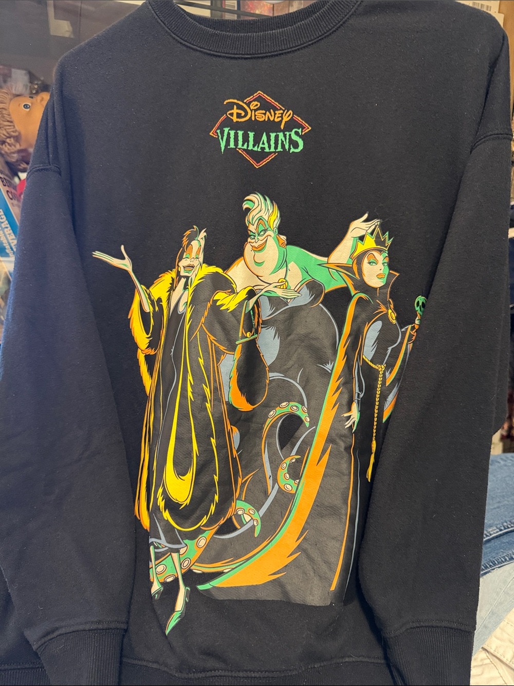 Disney Black Sweatshirt with Disney Villains Graphic and Green-Orange Accents